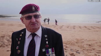 UK artists, veterans create 80 sand silhouettes on beach for 80th anniversary of D-Day landings