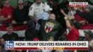Bikers for Trump member escorts protester out of Trump rally as audience erupts in ‘U-S-A’ chant