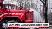 NJ wildfire scorches 13,500 acres as firefighters work toward containment
