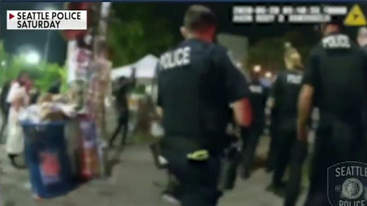 Seattle police officers confronted by protesters when responding to shooting inside 'CHOP' zone