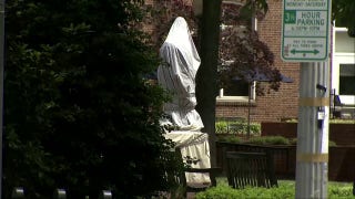 George Washington statue covered after police clear encampment at namesake university - Fox News