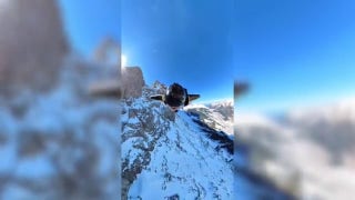 Wing suiter dives from helicopter, soars over stunning Swiss mountains - Fox News