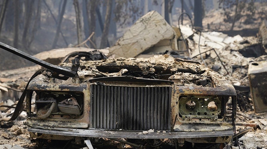 California residents return home to assess wildfire damage