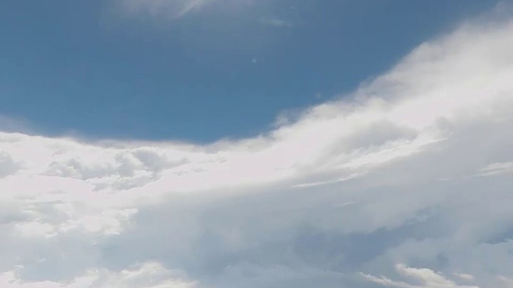 Air Force hurricane hunters inside Ian's eye capture eerie calm, blue skies
