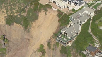 Three multimillion-dollar mansions teeter on the edge of a California cliffside after powerful storms