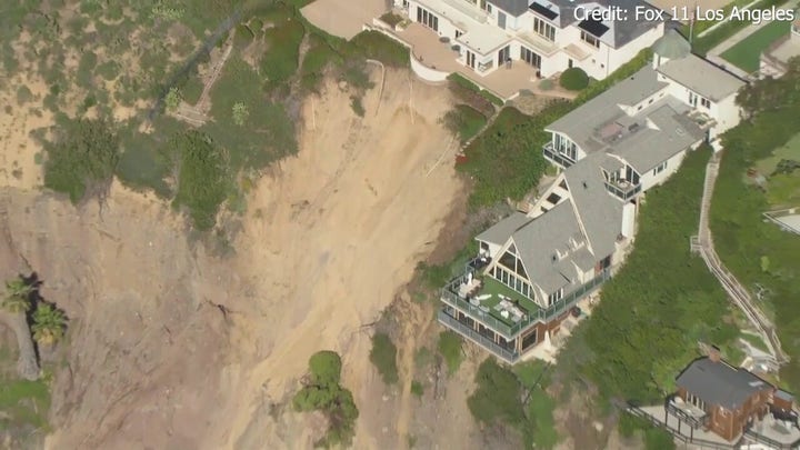 Three multimillion-dollar mansions teeter on the edge of a California cliffside after powerful storms