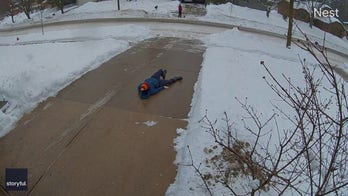 Dad slips on icy driveway as toddler tells him to take ‘little steps’