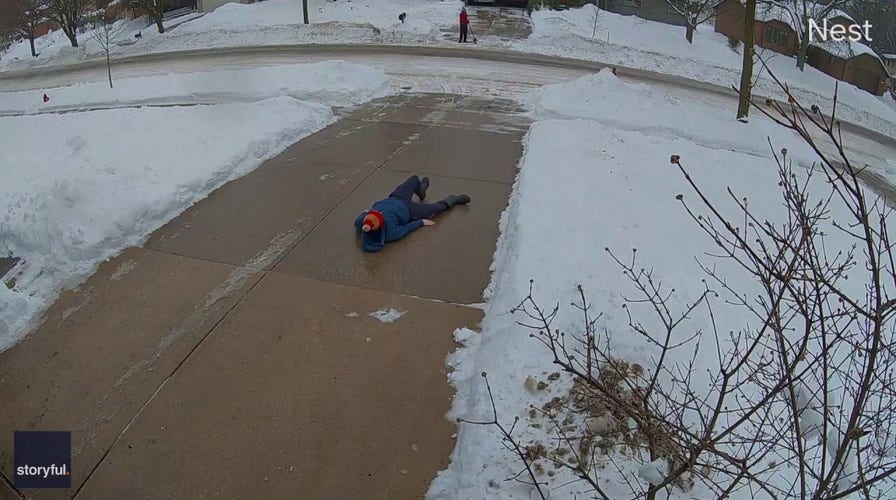 Dad slips on icy driveway as toddler tells him to take ‘little steps’