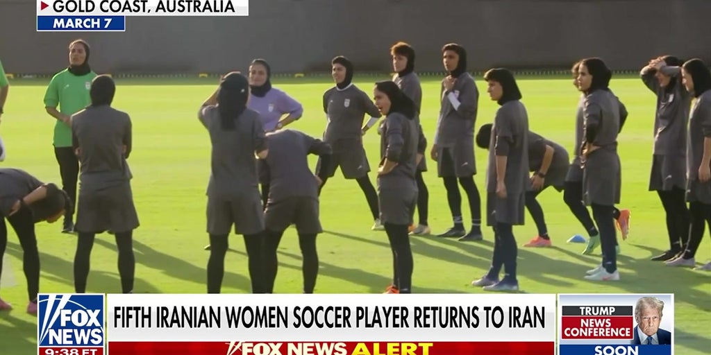 Iranian women's soccer players return home under pressure