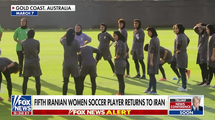 Iranian women's soccer players return home under pressure