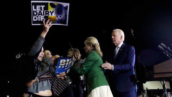 Joe Biden’s senior adviser tackles protesters at Super Tuesday rally 