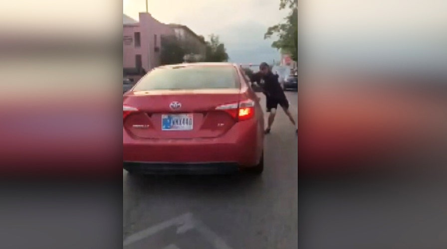 Car drives through anti-racism protest in Bloomington, Indiana<br>