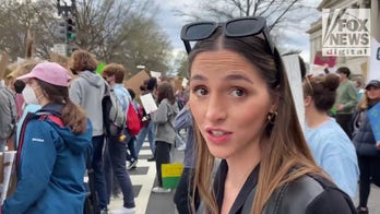 Activists march through DC demanding Biden declare a climate emergency