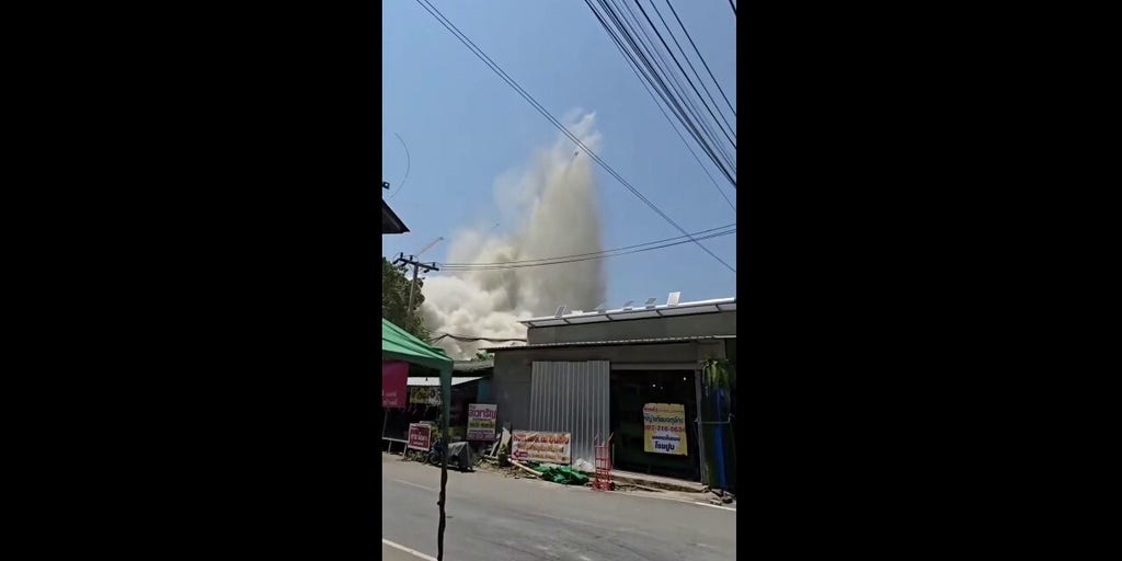 Chaos in Bangkok as apartment building collapses, sending people running