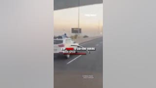 Officer clings to car roof during high-speed smuggler chase - Fox News