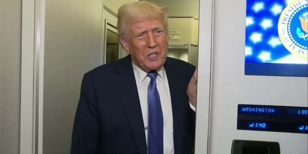 President Donald Trump speaks with reporters on Air Force One