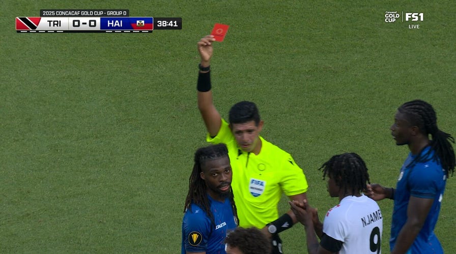 Haiti's Jean-Kevin Duverne picks up a red card vs. Trinidad & Tobago
