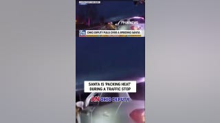 Santa is 'PACKING HEAT' during a traffic stop
