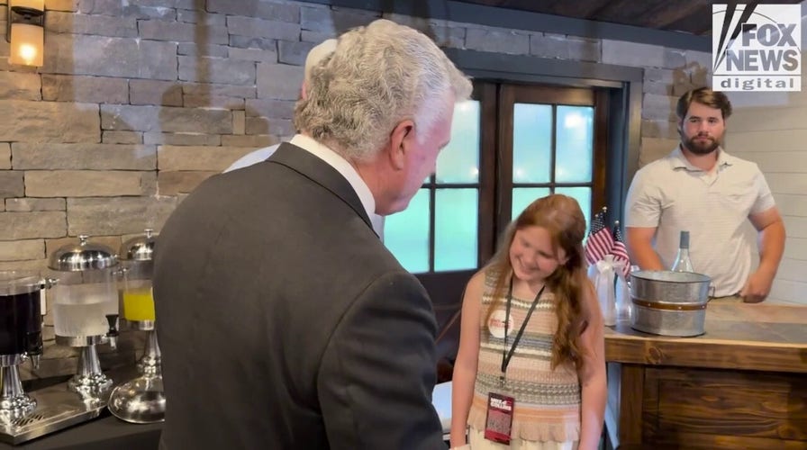 Georgia Rep. Mike Collins celebrates with supporters after winning GOP Senate nomination