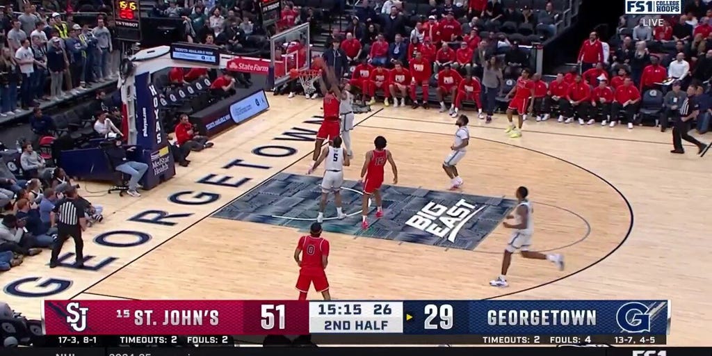 St. John's Zuby Ejiofor throws down a tough alley-oop dunk against Georgetown