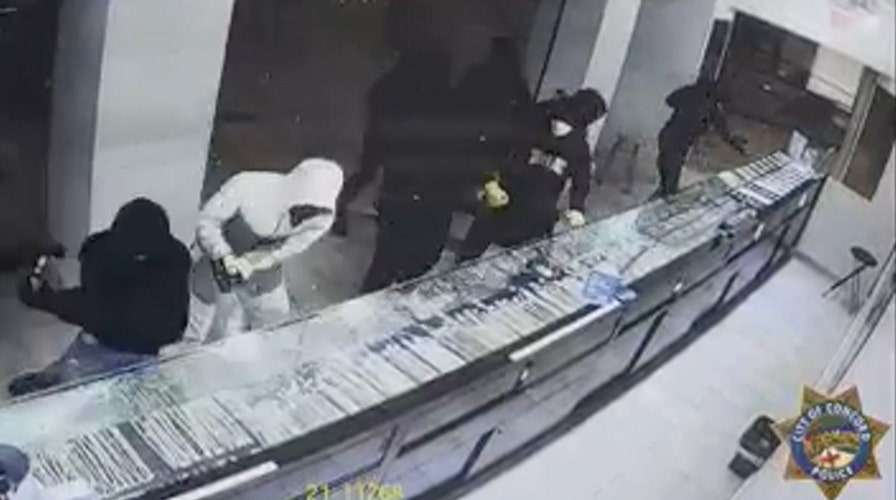 Masked thieves smash glass display cases at California jewelry store