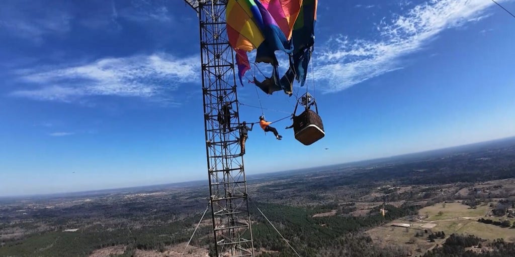 Hot air balloon crashes into 920-foot tower, two rescued in complex operation