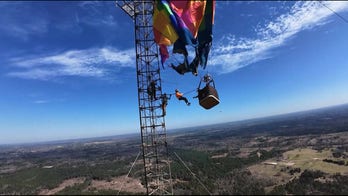 Hot air balloon crashes into 920-foot tower, two rescued in complex operation