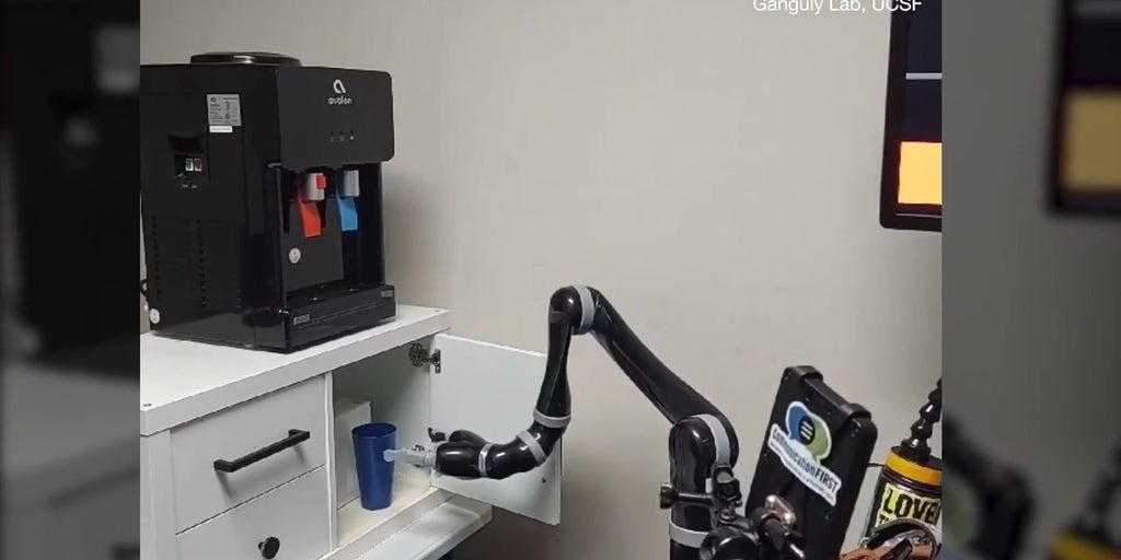AI enables paralyzed man to control robotic arm with brain signals