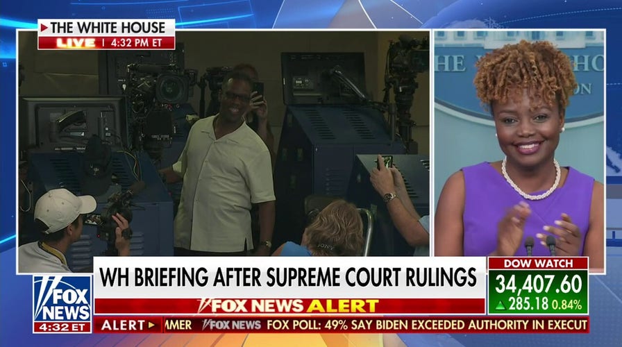 Karine Jean-Pierre congratulates Fox News' Ed Lewis on his retirement