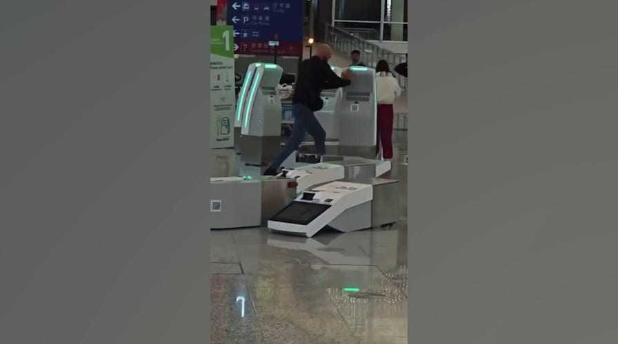 Tourist destroys check-in desks successful  Hong Kong airdrome  rampage