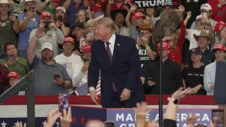 Trump arrives with hats for supporters at Ohio midterm rally