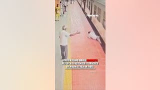 WATCH: Dramatic rescue as passenger DRAGGED from train in India