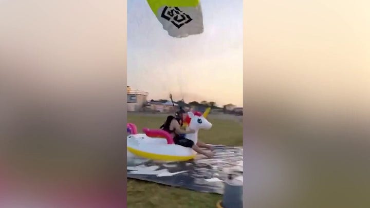 WATCH: Skydiver makes incredible landing on inflatable unicorn