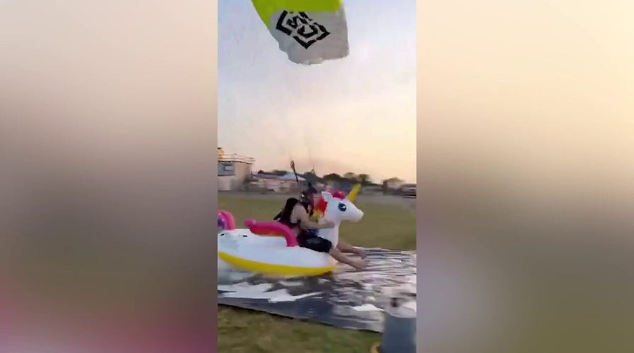WATCH: Skydiver makes incredible landing on inflatable unicorn