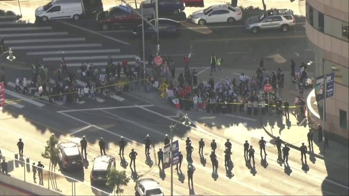 Anti-ICE student protesters face off with police in downtown LA