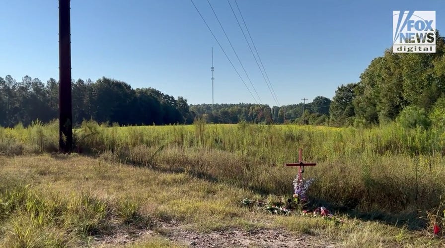 Commemorative gifts are laid where Lyric Woods' and Devin Clark's bodies were found
