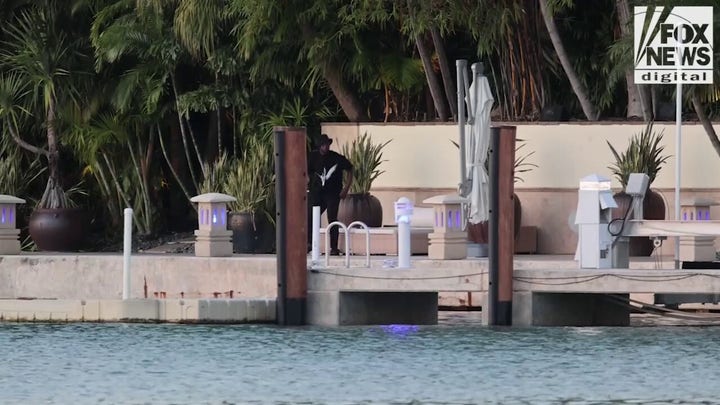 Sean "Diddy" Combs sits on the dock of his Star Island home.