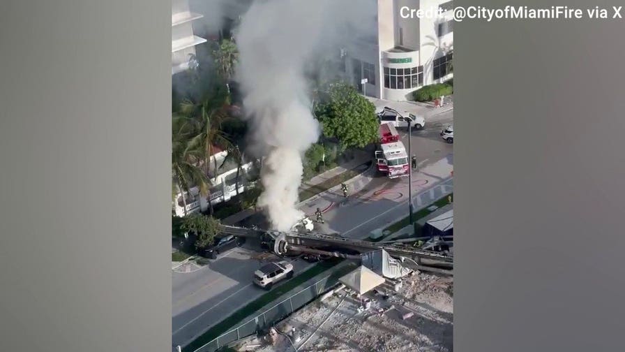 Car catches fire after massive rig collapse in Miami