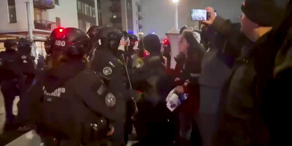 Portland protesters clash with police after federal immigration agent shoots 2