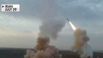 Iran unveils new missiles as tensions intensify over Trump's 'snapback' order on economic sanctions 