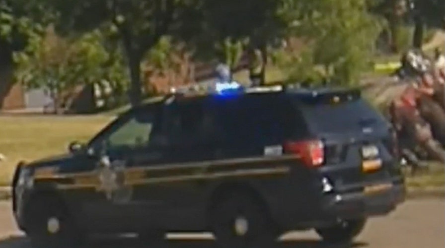 Michigan sheriff's deputies lift car off unconscious woman