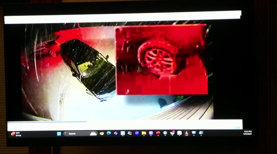 Zoomed in clip appears to show Karen Read backing into parked SUV