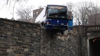 NYC MTA bus hangs precariously off overpass following collision - Fox News