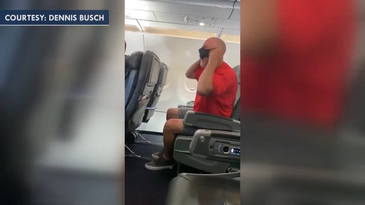 Unruly American Airlines passenger growls at flight crew, shouts 'Joe Biden, really?'