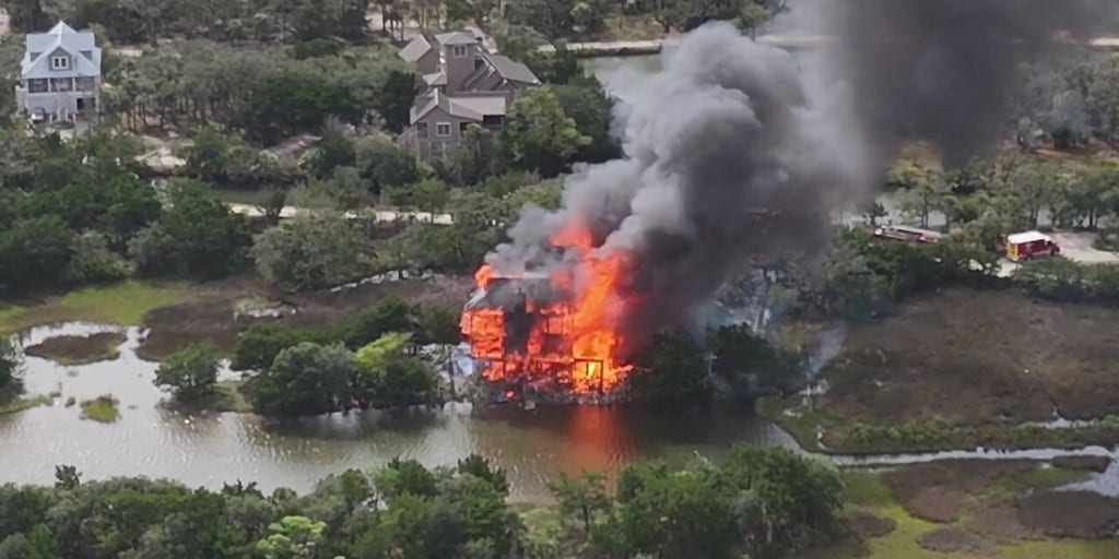 Aerial footage shows judge's waterfront mansion in flames