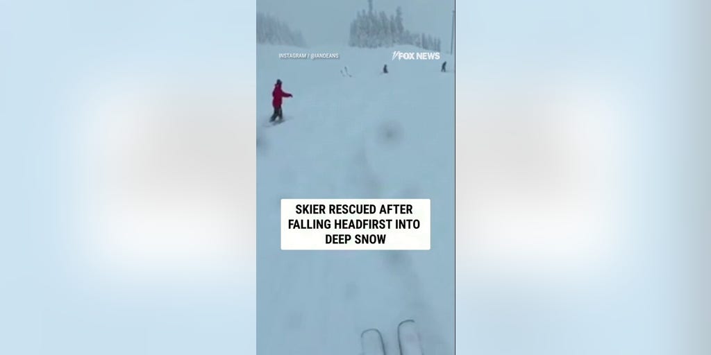 Skier RESCUED after falling HEAD FIRST into deep snow