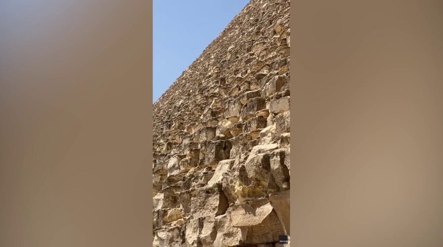 Daring dog on top of ancient Egyptian pyramid makes expert descent