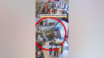 Shoppers run as car CRASHES through thrift store