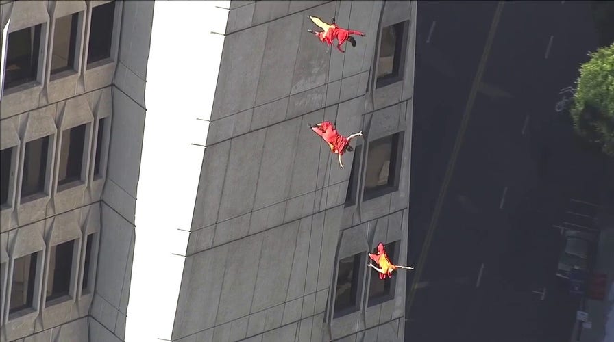 WATCH: Performers rappel down San Francisco landmark building