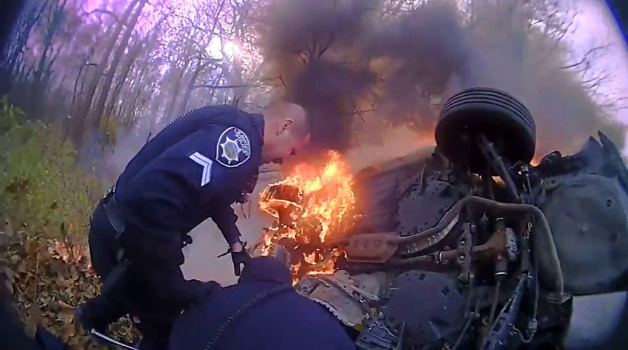 Kansas first responders rescue woman from burning car 